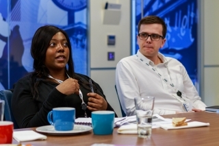 Members asking questions at event