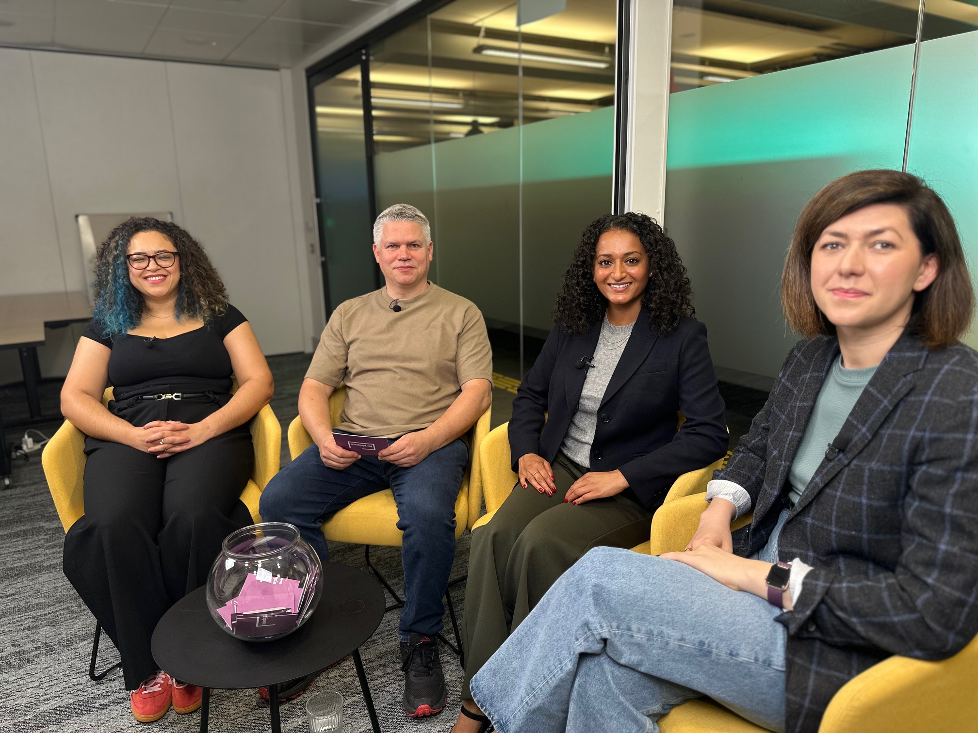 Image from recording session, showing Cherrelle, Giles, Iulia and Tulsi in tub chairs, smiling to camera